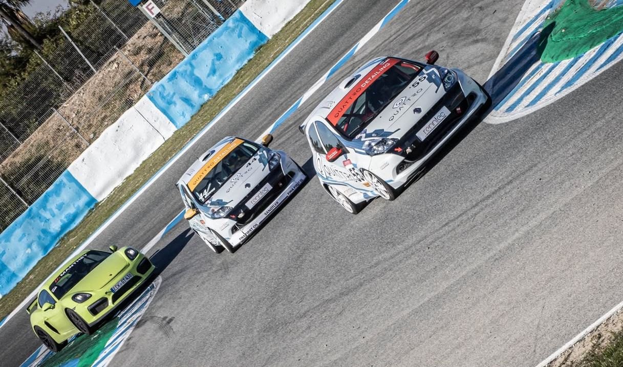 Race cars on track at a circuit, seen from above
